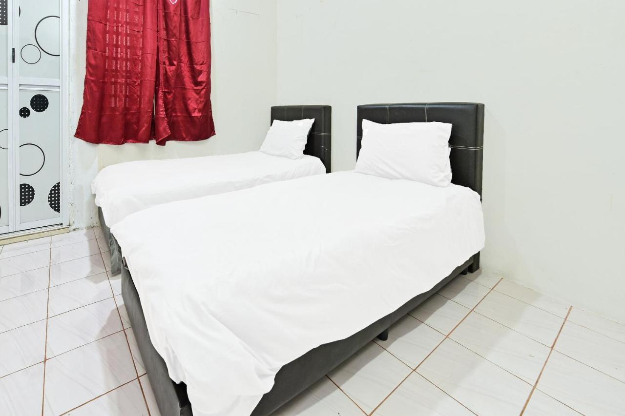 Oyo 90596 Casaria Inn Paka Exterior photo