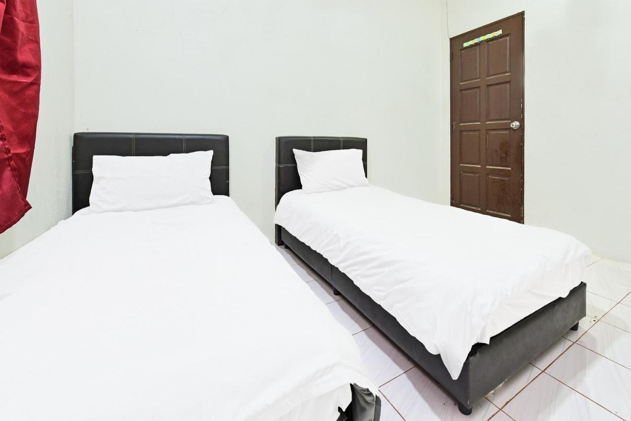 Oyo 90596 Casaria Inn Paka Exterior photo
