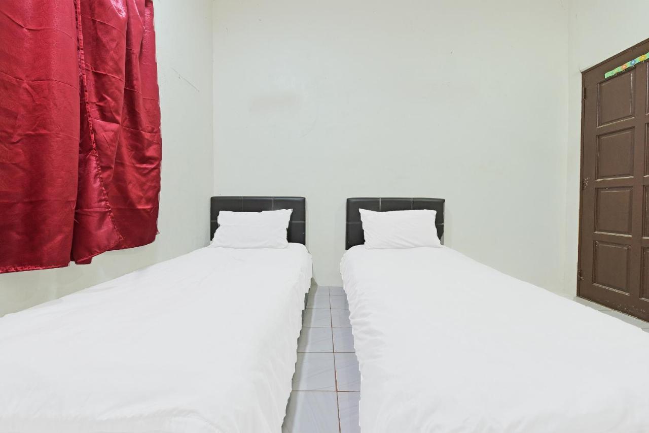 Oyo 90596 Casaria Inn Paka Exterior photo